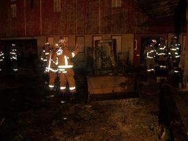 Skid Loader fire next to a barn. Box 8-4. No extension into buildings.